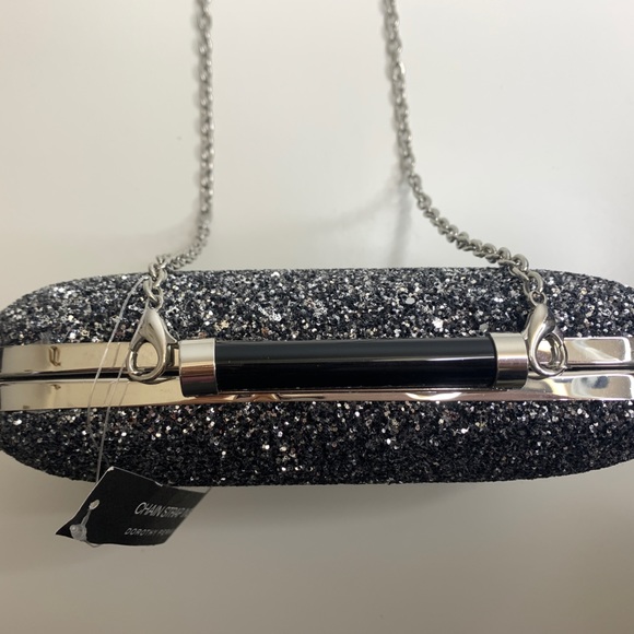 Black, silver glitter clutch. Chain can be easily removed. Hard shell. - Picture 2 of 3